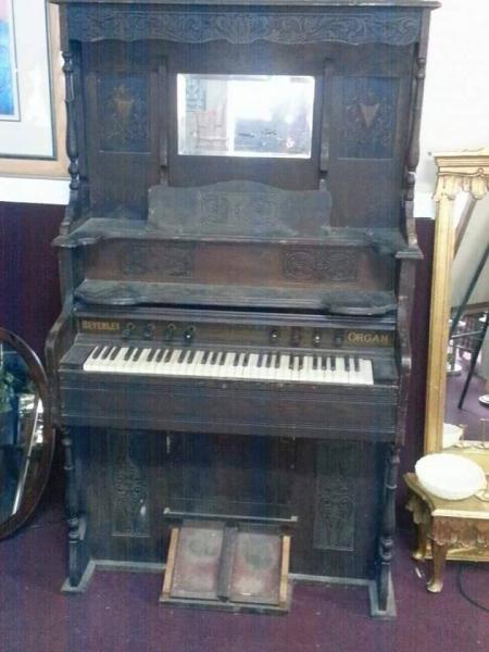 A very beaten up piano that needed some TLC to make it handsome again.