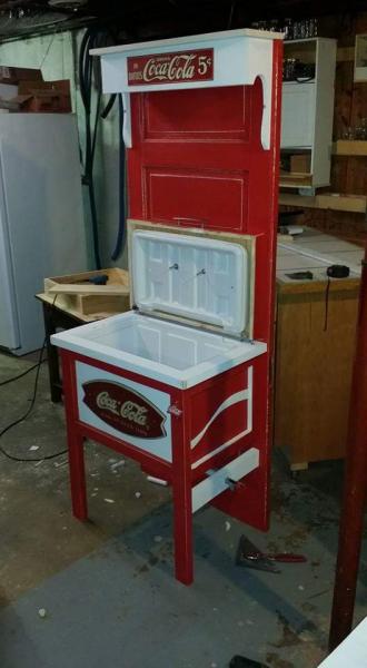 This red and white cooler is actually attached to a door so it stands sturdy. We love Coca Cola around here and this is one of our favorite pieces!