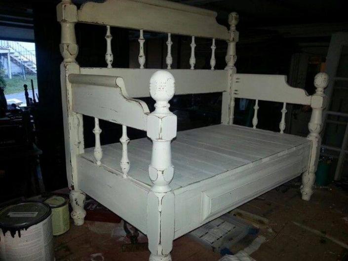 The finished product is a distressed white bench with a beautiful back and arms.