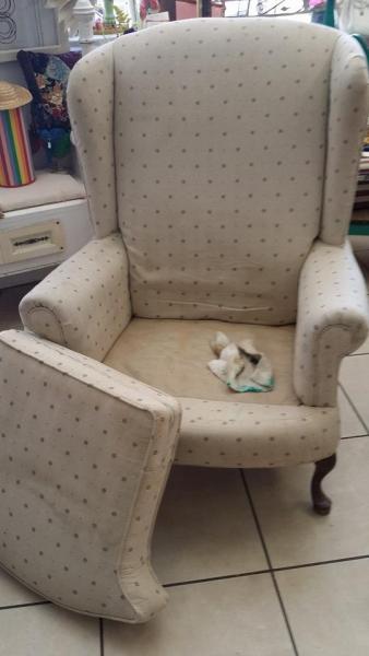 A customer brought this chair in for a makeover, notice the nice construction but stained upholstery.